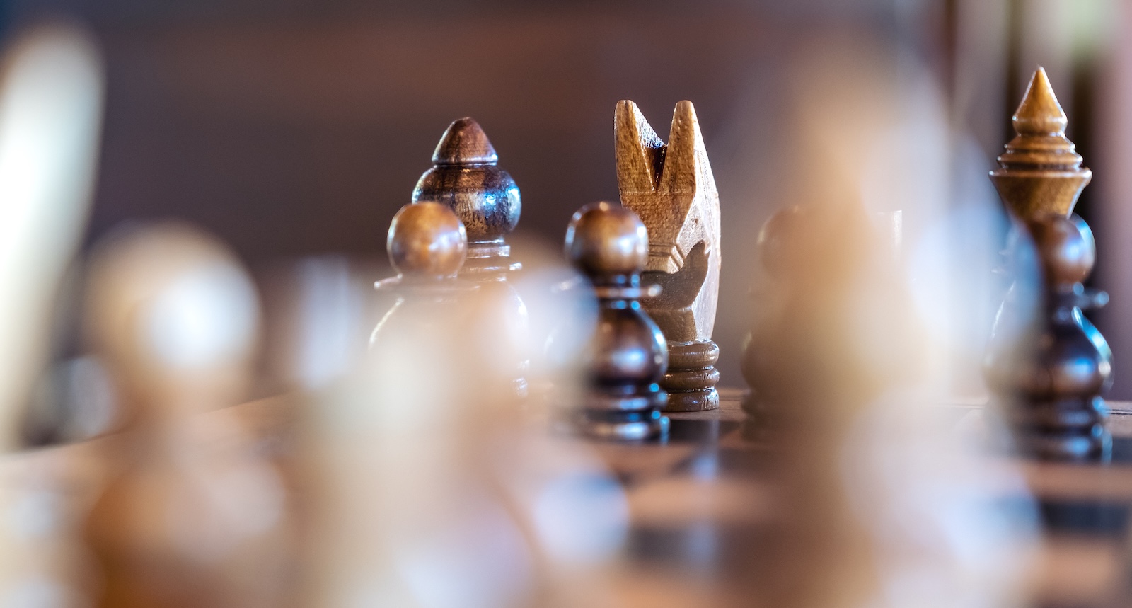 Closeup image of a wooden chess set on chessboard AI Skill Shift Strategies